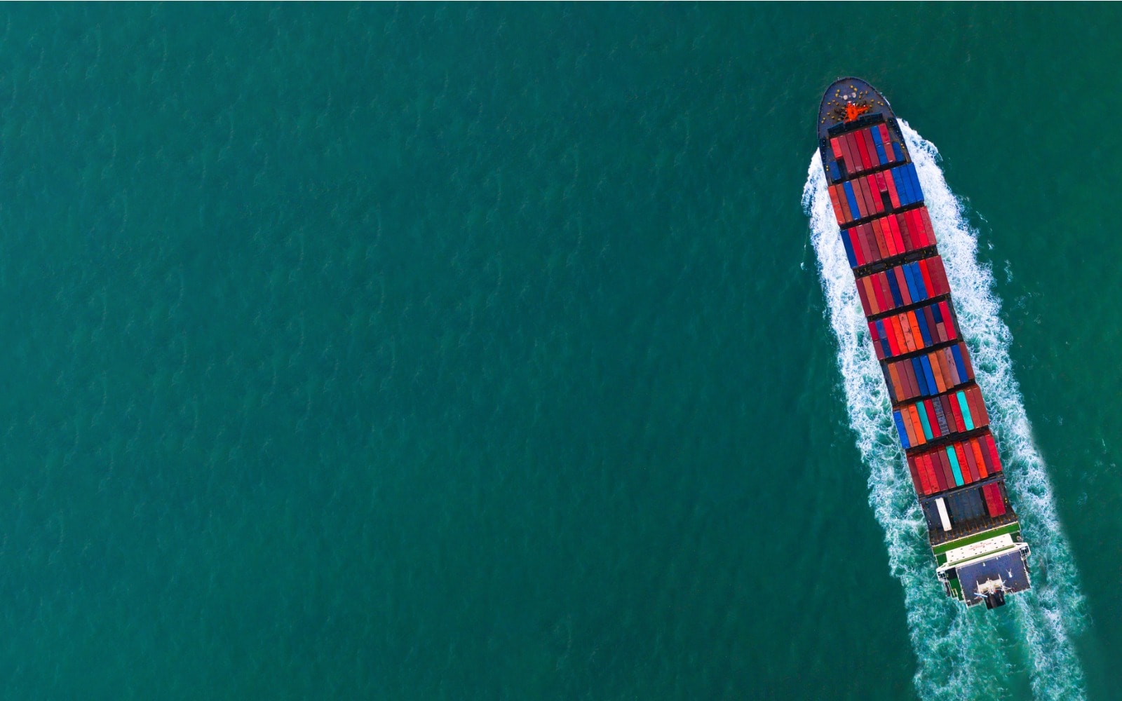 ocean container ship sailing through the ocean