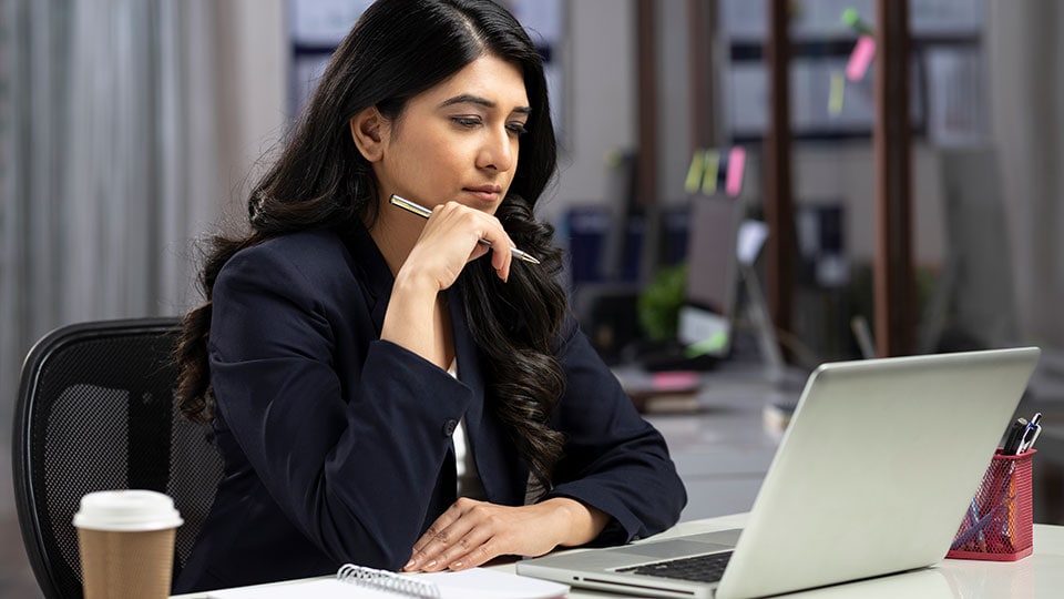 Woman researching on her laptop.