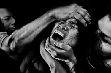 Photo of girl screaming with hands on her forehead and chin