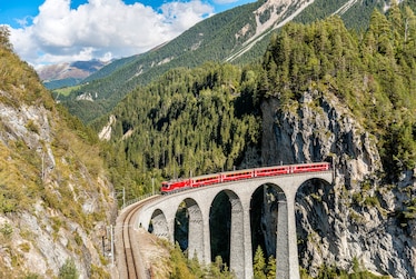 Glacier Express at the Landwasser Viaduct in the Swiss Alps