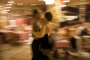 Photo of couple dancing with blurred background