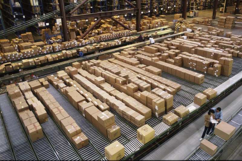 Boxes on conveyor belts in warehouse