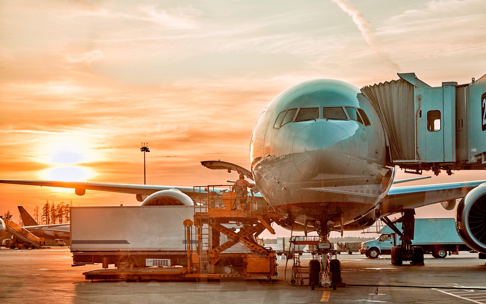 airplane being loaded at terminal gate, preparing for departure