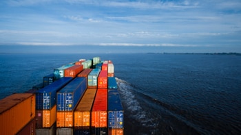 Overhead view of full container ship on water