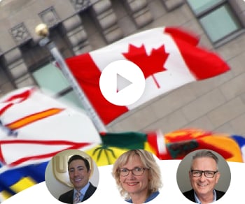 Canadian country and provincial flags blowing in the wind