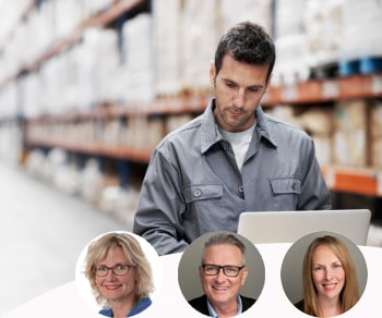 Man using computer in warehouse