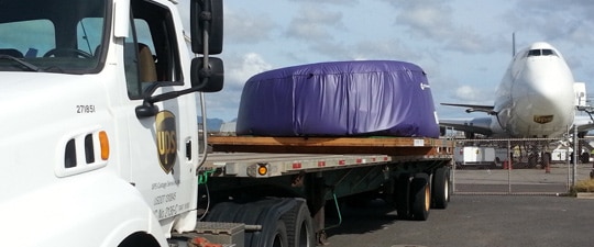 Engine cowling on ground freight tractor trailer