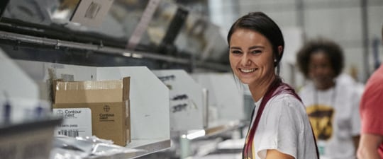 Female worker in medical devices fulfillment operation