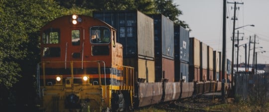 Cross-country freight containers traveling via railroad