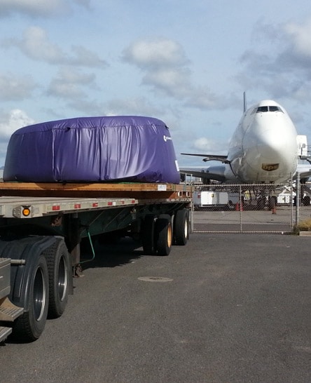 Engine cowling on ground freight tractor trailer