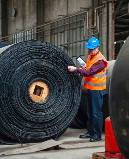 Heavy industrial freight rolling off assembly line for shipping