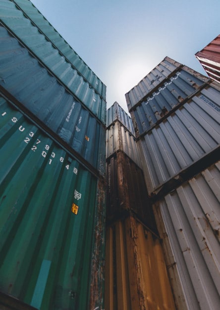 Stacked ocean containers reach to the sky