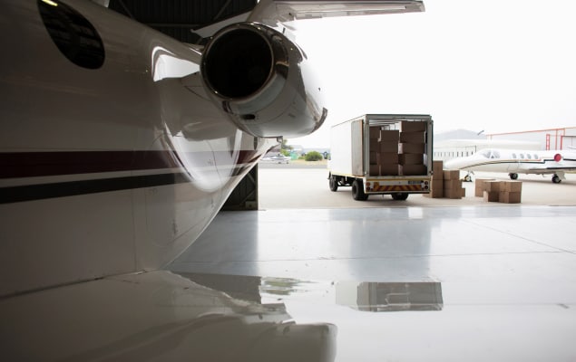 Packages ready to load on charter plane