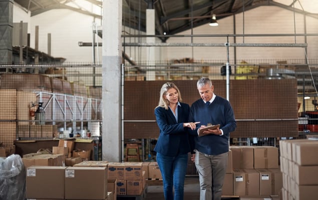 Woman business owner discussing alternative financing options with male colleague