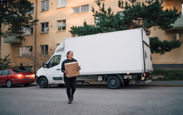 Woman hand-carrying a package