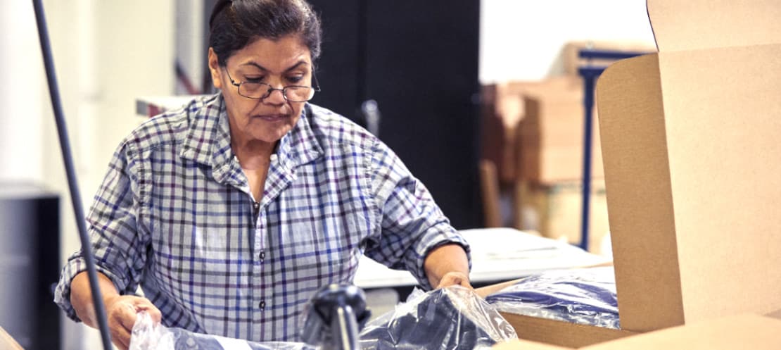 Woman packaging up an item to ship