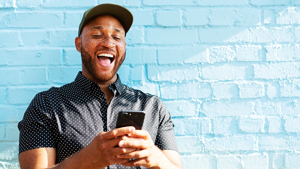 Man managing UPS profile on his smartphone