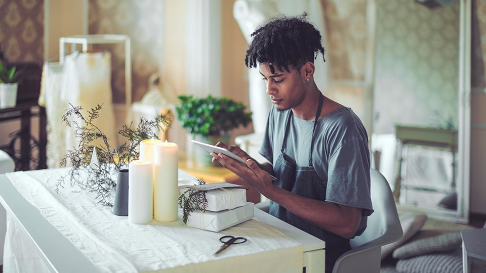 Small business owner using an iPad.