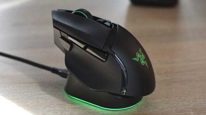 The Razer Basilisk V3 Pro gaming mouse on its wireless charging stand.