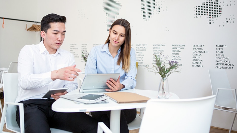 People sitting at meeting table