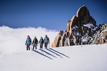 Festival-goers learn high-altitude hiking skills in the snow.