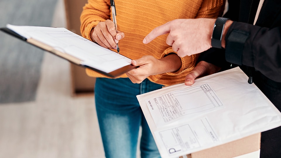 People reviewing international shipping documents