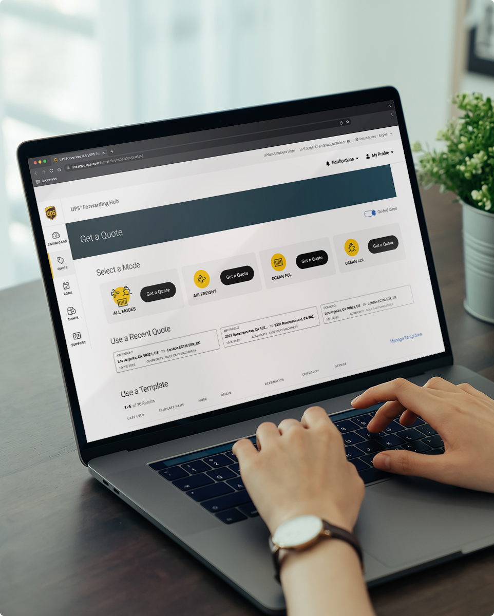 Person sitting at a desk on laptop viewing the UPS® Forwarding Hub Quote page